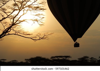 Hot Air Balloon Flying Over Savannah At Sunrise, Serengeti National Park, Tanzania