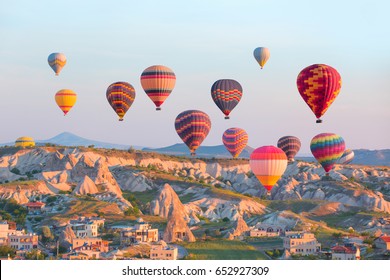 Hot air balloon flying over rock landscape at Cappadocia -Goreme, Turkey