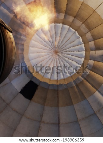 hot air balloon from inside, fabric texture viewed through hot air
