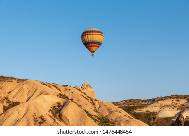 Hot air balloon over landscape of Cappadocia in Turkey