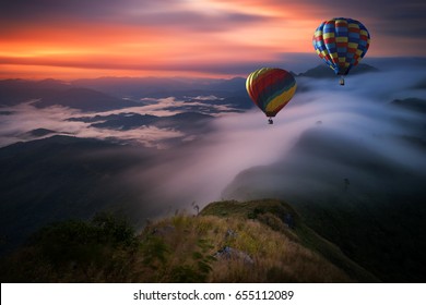 Hot air balloon over Pha Tang hill with beautiful mountain view and fog in morning, Chiang rai, Thailand - Shutterstock ID 655112089
