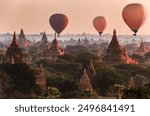 Hot air balloon over plain of Bagan in misty morning, Myanmar