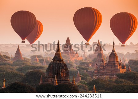 Hot air balloon over plain of Bagan in misty morning, Myanmar