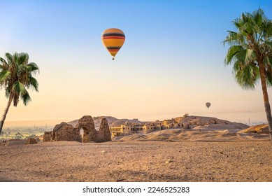 Hot air balloon over ruins of Hatshepsut temple in Luxor, Egypt - Shutterstock ID 2246525283