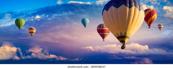 Hot Air Balloon Ride At Sunrise Background For Wide Banner Of Travel Agency Or Adventure Tour. Morning Hot-air Balloon Flight With Beautiful Clouds. Romance Of Ballooning In A Good Weather.