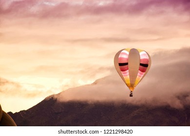 Hot Air Balloon Rising Over The Sandia Mountains