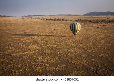 Hot air balloon in savannah - Shutterstock ID 401857051