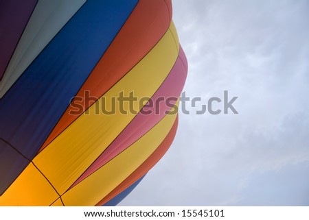 Hot air balloon taking off at sunset