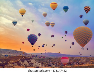 Hot Air balloons flying over Mountains landscape sunset vintage nature background