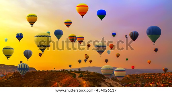 Hot air balloons landing in a mountain Cappadocia\
Goreme National Park\
Turkey.