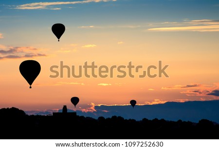 Hot air balloons on sunset. Beautiful nature sky background.