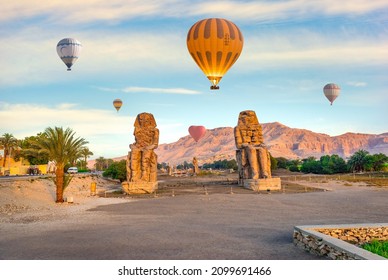 Hot air balloons over Colossi of Memnon in Luxor, Egypt