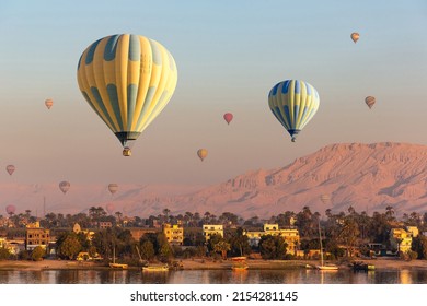 Hot air balloons over Nile river and Valley of Kings in Luxor at sunrise in Egypt - Shutterstock ID 2154281145