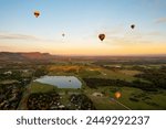 Hot air balloons in Pokolbin wine region, aerial image of wineries and vineyards from balloon Hunter Valley, NSW, Australia	