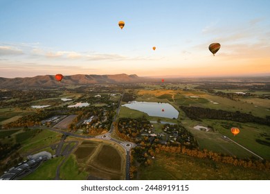 Hot air balloons in Pokolbin wine region, aerial landscape at sunrise, Pokolbin, Hunter Valley, NSW, Australia	 - Powered by Shutterstock