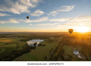 Hot air balloons in Pokolbin wine region near hunter vally gardens as sunrise aerial photo, Hunter Valley, NSW, Australia	 - Powered by Shutterstock