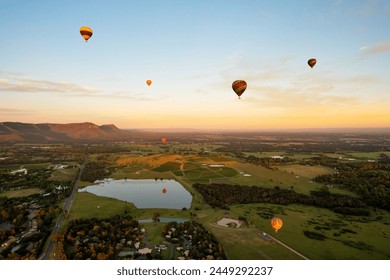 Hot air balloons in Pokolbin wine region, aerial image of wineries and vineyards from balloon Hunter Valley, NSW, Australia	 - Powered by Shutterstock