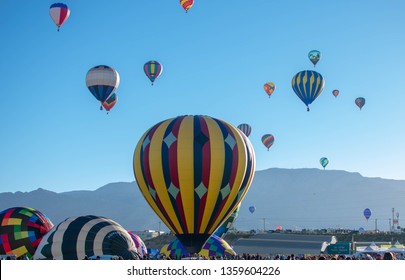 Hot Air Balloons With The Sandia Mountains In The Background. ABQ International Balloon Fiesta.