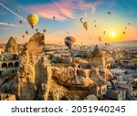 Hot air balloons at sunset in Goreme village, Cappadocia, Turkey