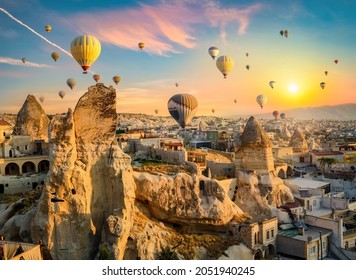 Hot air balloons at sunset in Goreme village, Cappadocia, Turkey - Shutterstock ID 2051940245