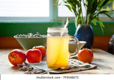 Hot Apple Cider Vinegar And Honey Drink With Apples On A Table