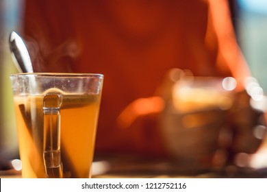 Hot Apple Cider With Woman In The Background