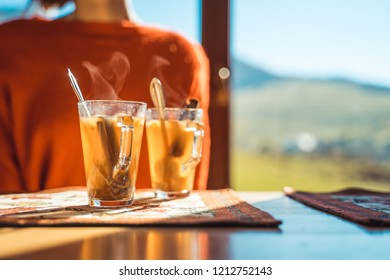 Hot Apple Cider With Woman In The Background