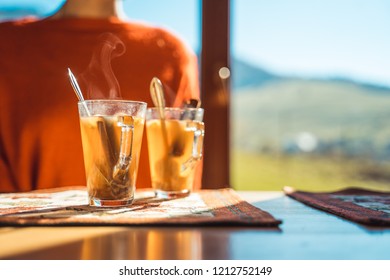 Hot Apple Cider With Woman In The Background