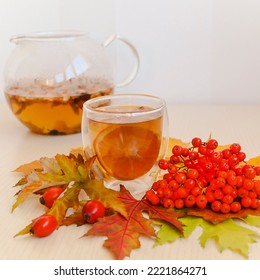 Hot Autumn Drink With Rowan, Rose Hips And Lemon