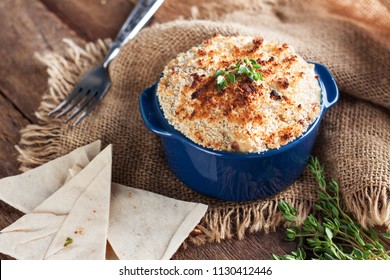 Hot Baked Dip With Caramelized Onion, Bacon And Cheese On Rustic Background