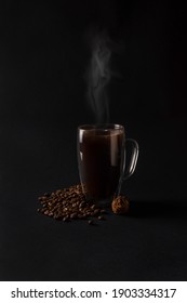 Hot Black Coffee In A Glass Cup With Chocolate Truffle And Many Coffee Beans On Dark Background. Breakfast Coffee Love Concept. Front View