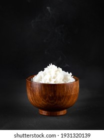 Hot Boiled Jasmin Rice With Steam On Black Background
