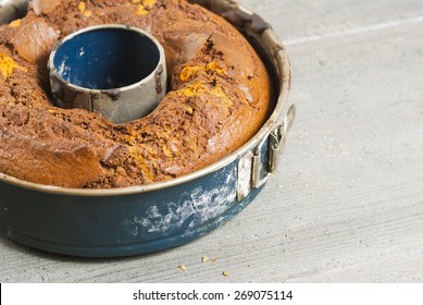 Hot Bundt Cake In Baking Tin, Old Wood Table Background