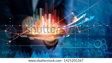 Hot business growth. Businessman using tablet analyzing sales data and economic growth graph chart. Business strategy, financial and banking. Digital marketing. 