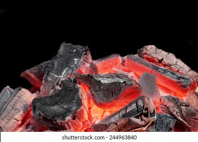 Hot Charcoal In The BBQ Grill Pit Isolated On Black Background