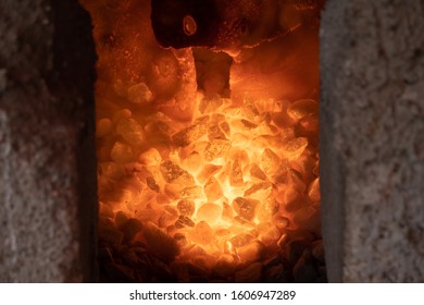 Hot charcoal fire oven prep for barbeque - Shutterstock ID 1606947289