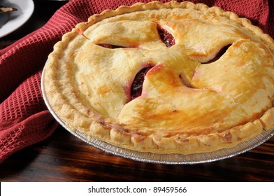 A hot cherry pie cooling on the counter