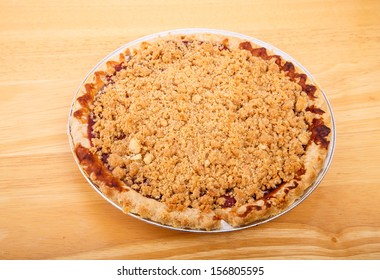 A Hot Cherry Pie With Flaky Crust And Crumb Topping