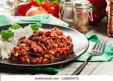 Hot Chili Con Carne With Ground Beef, Beans, Tomatoes And Corn Served With Rice. Mexican Cuisine