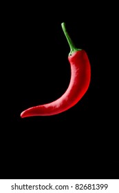 Hot Chilli Pepper Floating Over Black Background