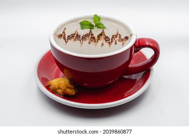 Hot Choco Mint In A Red Cup With Biscuit On Top Of A Red Saucer On White Background 