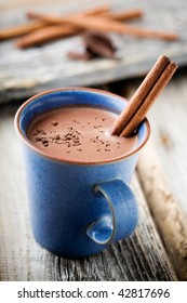 Hot Chocolate With Cinnamon Stick In Blue Cup