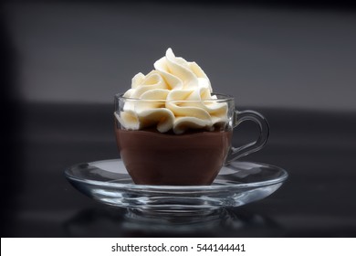 Hot chocolate cocoa with whipped cream on vintage wooden background, selective focus - Powered by Shutterstock