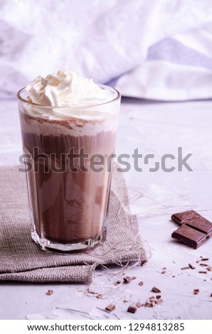 hot chocolate with cream, powdered sugar and berries