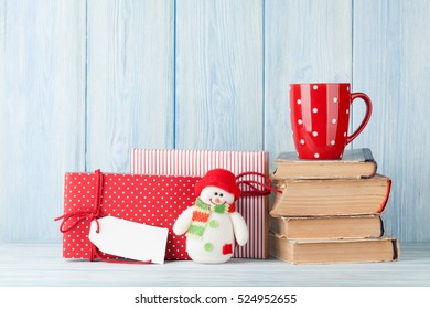 Hot chocolate cup and christmas gift boxes. View with copy space - Powered by Shutterstock