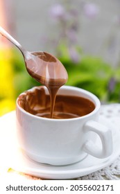 Hot Chocolate Cup On Table At Cafe Outdoors Summer. Coffee Time And Breakfast In Restaurant. Chocolate, Hot Frothed Milk, Cocoa. Street Cafe. Milk Dark Chocolate