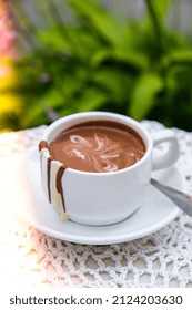 Hot Chocolate Cup On Table At Cafe Outdoors Summer. Coffee Time And Breakfast In Restaurant. Chocolate, Hot Frothed Milk, Cocoa. Street Cafe. Milk Dark Chocolate