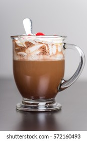 Hot Chocolate In Glass Mug With Whipped Cream And A Cherry