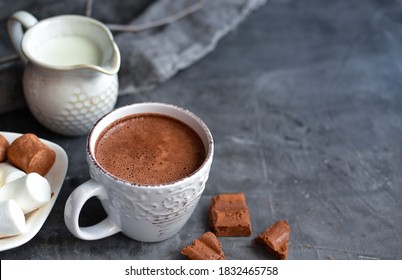 Hot chocolate and marshmallows. Hot Cocoa in a white cup. Dark background. Autumn drink concept. Copy space. - Powered by Shutterstock