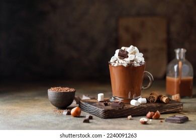 Hot chocolate with marshmallows on dark background. Hot beverage with cocoa  - Powered by Shutterstock